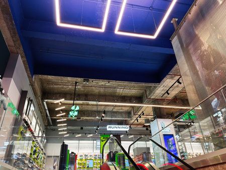 Manchester, UK - December 01, 2025: Modern gym and running gear shop in Manchester with bright blue...