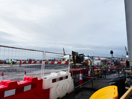 Manchester, UK - January 12, 2026: Manchester airport construction on the tarmac with safety...
