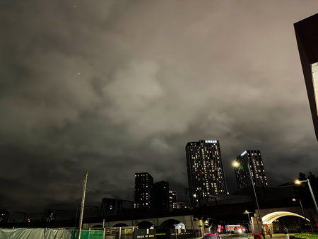Manchester, UK - January 21, 2026: Urban night scene in Manchester with Union high rise towers, lit streets, and a moody sky.のeditorial素材