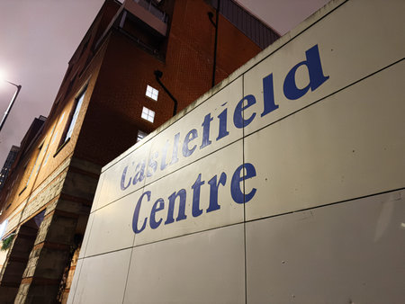 Manchester, UK - January 21, 2026: Nighttime exterior of Castlefield Centre wall with bold blue letters, reflecting urban Manchester atmosphere.のeditorial素材