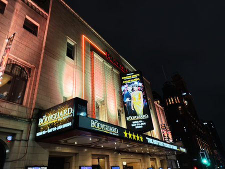 Manchester, UK - January 21, 2026: A vibrant city theater sign at night promoting the Bodyguard musical in Manchester, UK.のeditorial素材