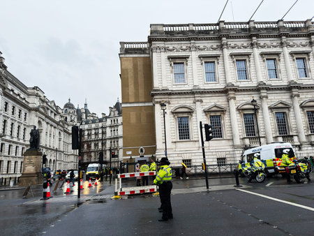 London, UK - February 01, 2026: A London street scene shows police barriers and vehicles during a protest in the city.のeditorial素材