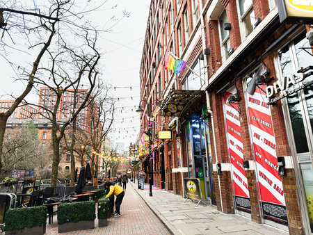 Manchester, UK - January 22, 2026: Urban Manchester street with string lights, outdoor Divas...