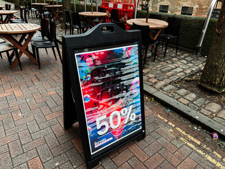 Manchester, UK - January 22, 2026: Vibrant urban cafe scene in Manchester with promotional The...
