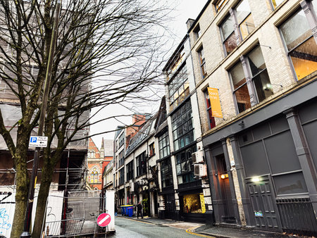 Manchester, UK - January 22, 2026: Urban street scene in Manchester showing modern and historic...