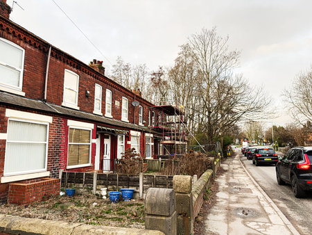 Manchester, UK - January 23, 2026: Residential Brook Terrace street in Manchester, UK, featuring brick houses, scaffolding, and quiet urban life.のeditorial素材