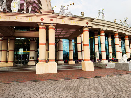 Manchester, UK - January 23, 2026: A grand Trafford Centre mall entrance with tall cream columns, glass doors, and statues in Manchester, UK.のeditorial素材