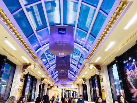 Manchester, UK - January 23, 2026: Shoppers walk through a brightly lit glass skylight corridor at the Trafford Palazzo, Manchester.のeditorial素材