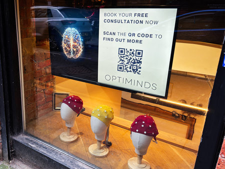Manchester, UK - January 30, 2026: Advertising image in a Manchester Optiminds storefront window...