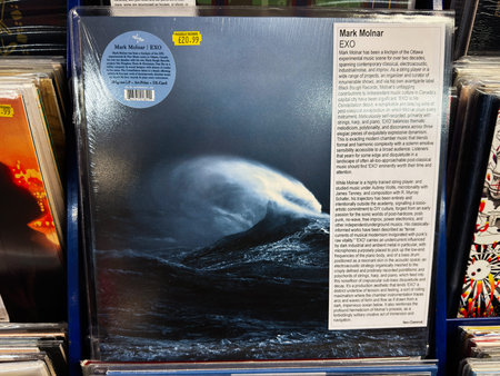 Manchester, UK - February 22, 2026: Moody blue vinyl album cover of Mark Molnar's EXO displayed...
