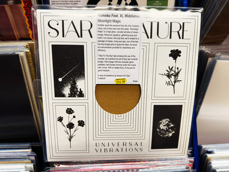 Manchester, UK - February 28, 2026: Vinyl album sleeve for Moonlight Magic by Kumoko feat. XL Middleton displayed among records on a store shelf.のeditorial素材