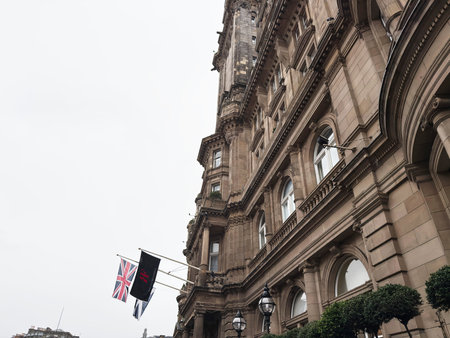 Edinburgh, Scotland, UK - February 15, 2026: Ornate Victorian sandstone facade with Union flag and...