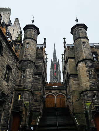 Edinburgh, Scotland, UK - February 15, 2026: Moody view of a gothic cathedral spire framed by...