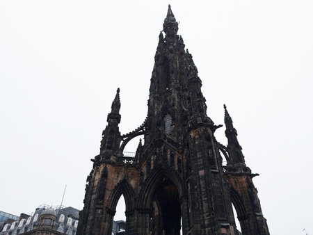 Dramatic view of Scott Monument Gothic spire and ornate stonework in Edinburgh, Scotland, UK.の写真素材