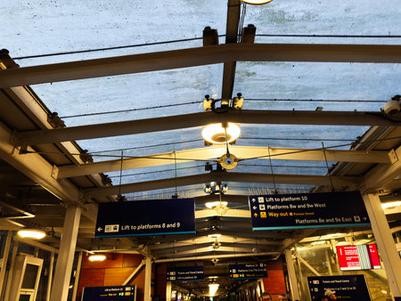 Edinburgh, Scotland, UK - February 15, 2026: Nighttime view of an Edinburgh station platform with...