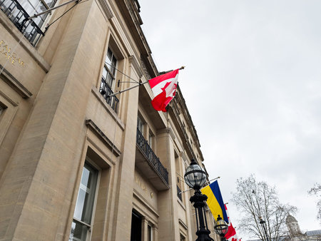London, UK - February 02, 2026: Canadian and ukrainian flag waves from a historic London, UK...