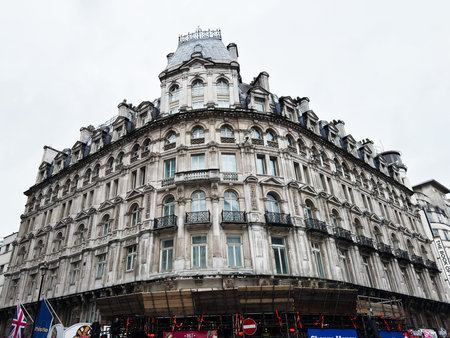 London, UK - February 02, 2026: Historic curved stone facade in central London UK featuring ornate balconies, arched windows and decorative masonryのeditorial素材