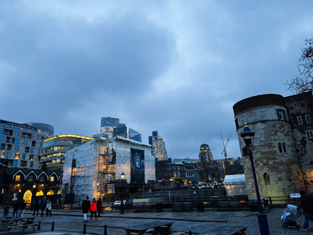 London, UK - February 02, 2026: Dramatic dusk scene of the Tower of London beside modern...