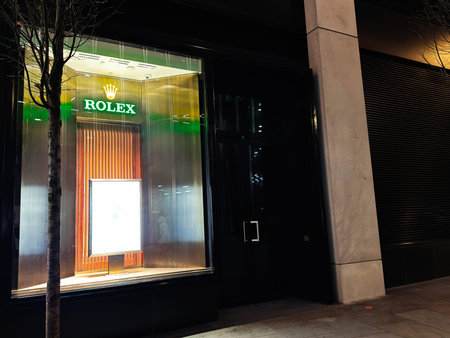 London, UK - February 02, 2026: Illuminated Rolex display window at night in London UK showcasing...