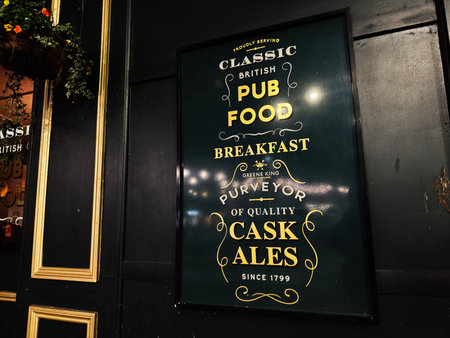 London, UK - February 02, 2026: Vintage dark green pub sign promoting classic British pub food,...