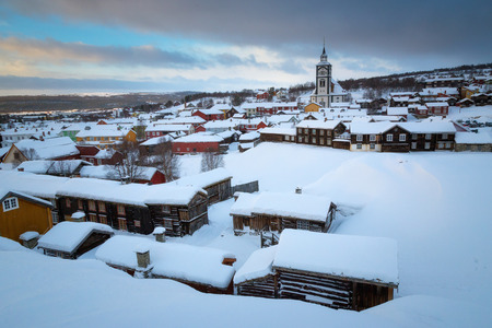 Wintertime in Roros, mining old town. Original wooden architecture covered by snow. Cold winter scenery.の写真素材