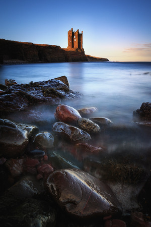 Old Keiss Castle ruins by the coast of North Sea, nerthern parts of scottish Highlands, Scotland.の写真素材