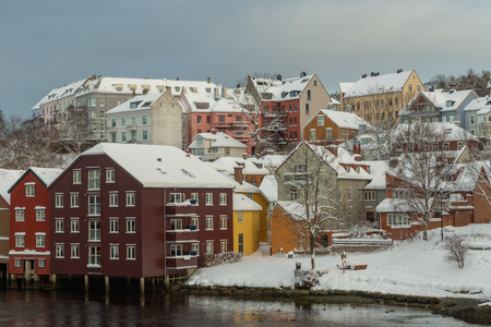Baklandet street under snow. Wintertime in Trondheim, Norway. Colorful town buildings, original old town look.の写真素材