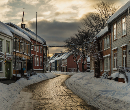 Baklandet street under snow. Wintertime in Trondheim, Norway. Colorful town buildings, original old town look.の写真素材
