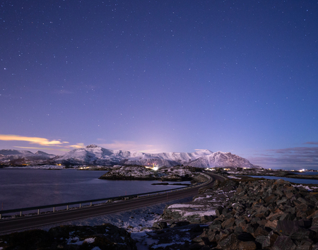 Night with the moon and view on the Atlantic Ocean Road (Atlanterhavsveien) in Norway. Wintertime landscapes and colours.の写真素材