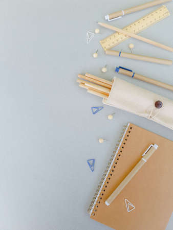 School subjects are laid out on a gray background. Eco-friendly craft items for the office. High quality photoの写真素材