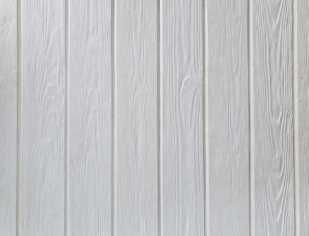 The background is made of white wooden material. White wooden background. Empty for the design.の写真素材