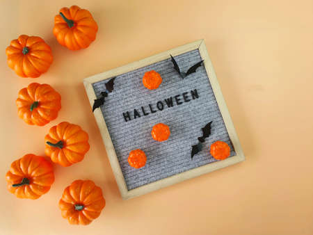 The word Halloween is laid out on a felt background