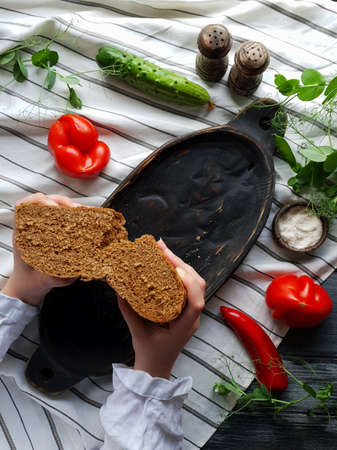 Handmade wooden tableware. Beautiful serving of dishes. Folk cuisine. Russian traditions.の写真素材