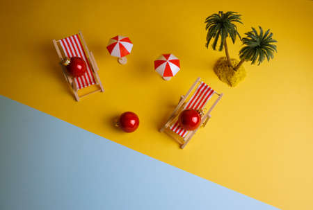 Creative New Year photo Christmas balls resting on the beachの写真素材