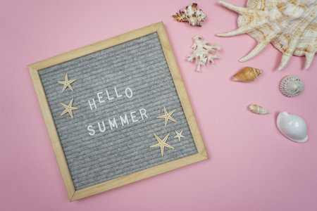 A board with the word Hello, summer written on itの写真素材