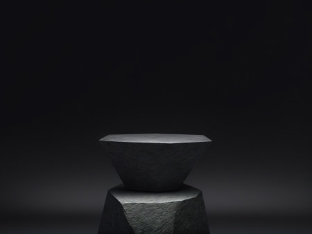 3d render of simple stone pedestal on dark background with copy space.の素材