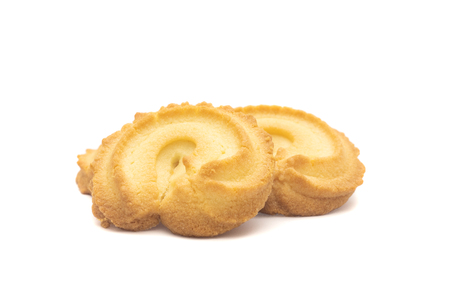 one side of two butter cookies on white backgroundの写真素材