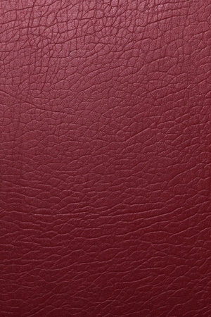 Red leather texture background. Close up of red leather texture background.の素材