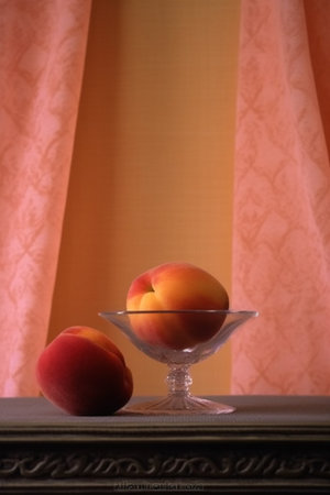 Still life with peaches in a glass vase on the background of curtainsの素材