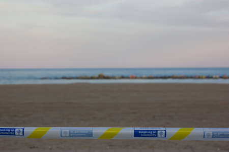 Barcelona, Spain, 02 May 2020. Barceloneta beach across and closed with the Barcelona City Cordon Tapeのeditorial素材