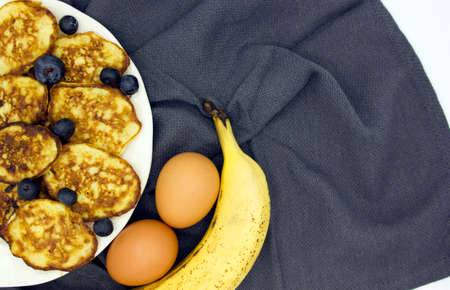 Breakfast oatmeal pancakes with banana and ingredients