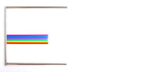 Ecology. Letter "E" made of Eco metal and plastic multi-colored cocktail straws on white background with space for text. Zero waste reusable sustainable cocktail metal strawの写真素材