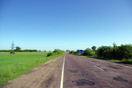 Road through green fieldsの写真素材