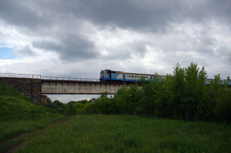 train goes by rail in the summerの写真素材