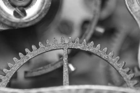 Black white background with metal cogwheels a old clockwork. Conceptual photo for your successful...