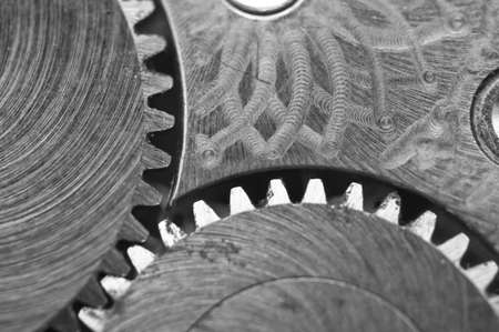 Black white background with metal cogwheels a old clockwork. Conceptual photo for your successful...