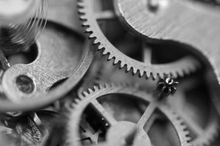 Black and white background with metal cogwheels inside clockwork. Conceptual photo for your successful business design. Macro.の写真素材