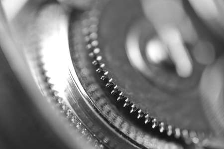Black white Background with metal cogwheels a clockwork. Macro. Conceptual photo for your successful...