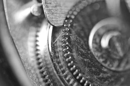 Black white Background with metal cogwheels a clockwork. Macro. Conceptual photo for your successful...