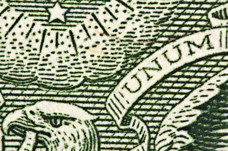 Element of the image of  United States one-dollar bill, Head of an eagle a word UNUM. Macroの写真素材